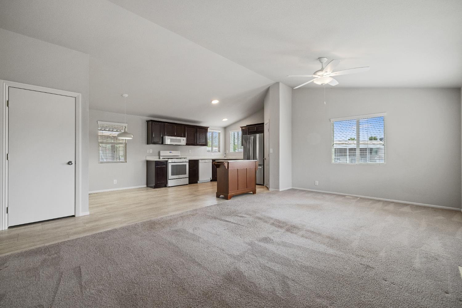 2621 Prescott, Unit 92 Modesto, CA 95350 - Photo 7 of 25 an empty room with windows and fireplace