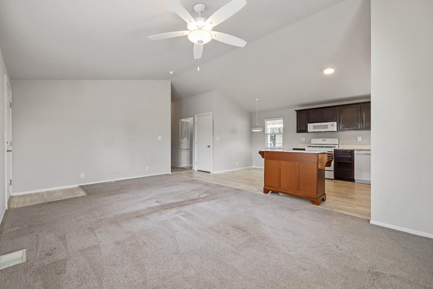 2621 Prescott, Unit 92 Modesto, CA 95350 - Photo 8 of 25 a view of a kitchen with a sink cabinets and entryway
