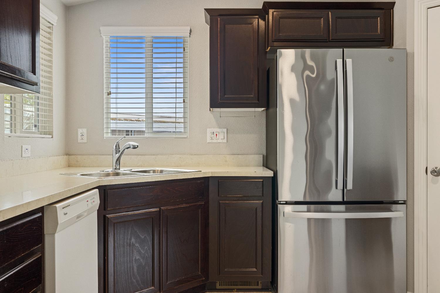 2621 Prescott, Unit 92 Modesto, CA 95350 - Photo 10 of 25 a kitchen with a refrigerator and sink