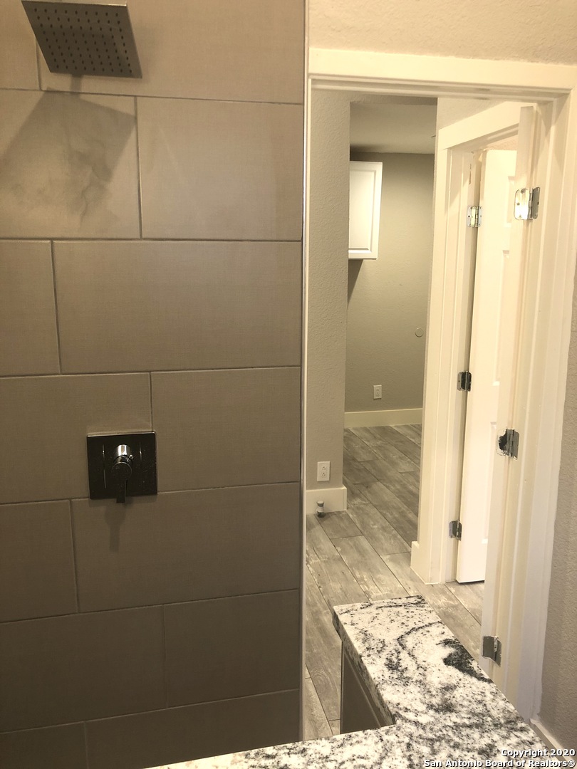 603 Devine Street, Unit 2 San Antonio, TX 78210 - Photo 12 of 16 a bathroom with a shower
