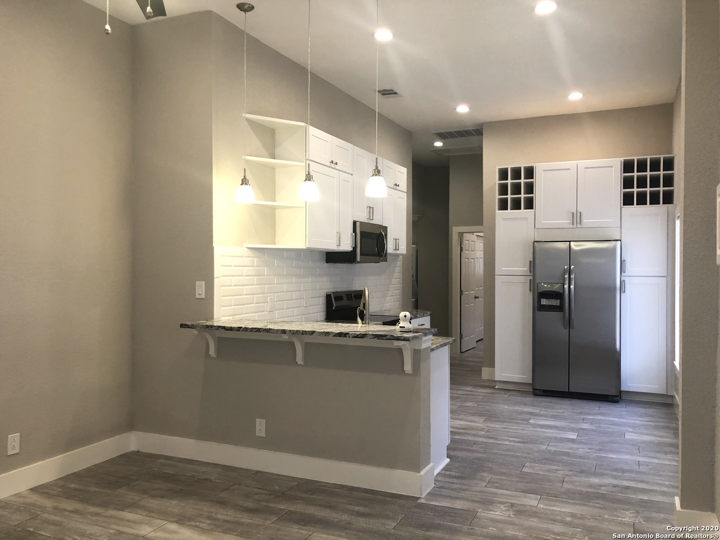 603 Devine Street, Unit 2 San Antonio, TX 78210 - Photo 4 of 16 a kitchen with stainless steel appliances a refrigerator and a sink