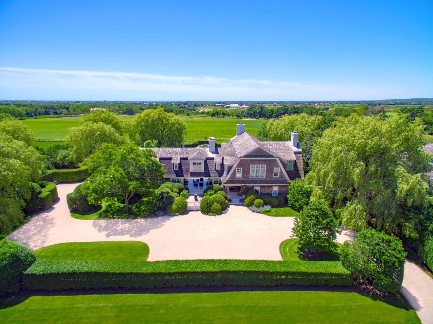 10 Dannielles Way Bridgehampton, NY 11976 - Photo 1 of 27 a view of a yard with an outdoor seating and mountain view