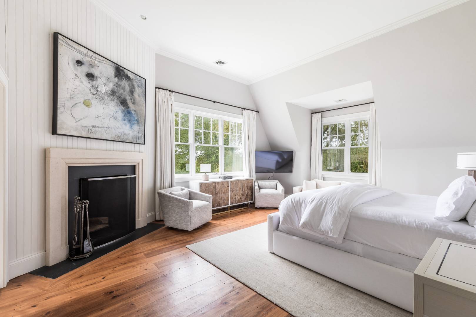 10 Dannielles Way Bridgehampton, NY 11976 - Photo 12 of 27 a living room with furniture and a fireplace