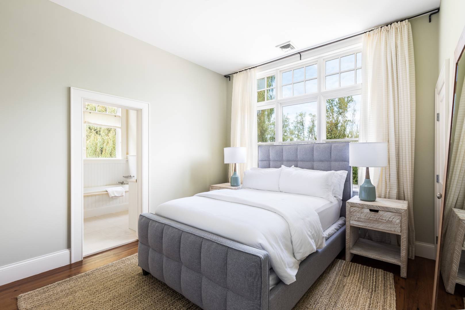 10 Dannielles Way Bridgehampton, NY 11976 - Photo 19 of 27 a bedroom with a bed and a window