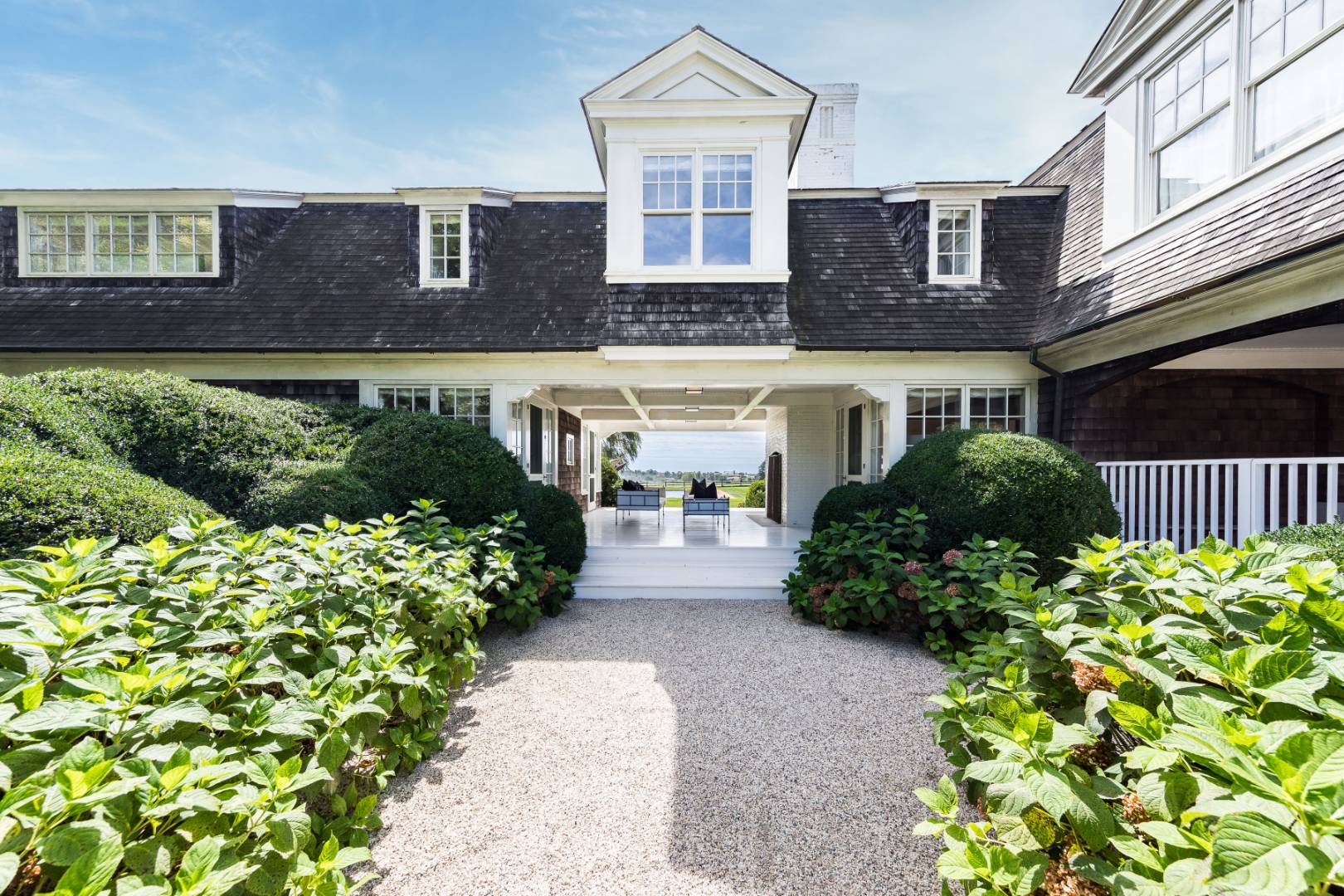 10 Dannielles Way Bridgehampton, NY 11976 - Photo 3 of 27 a front view of a house with a yard