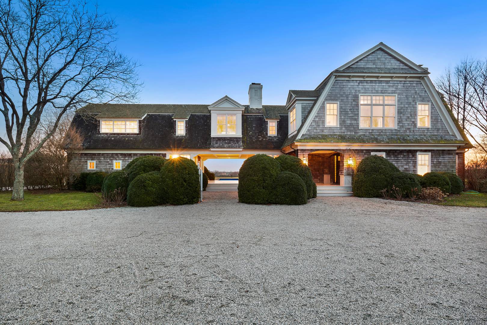 10 Dannielles Way Bridgehampton, NY 11976 - Photo 27 of 27 a front view of a house with a yard and garage