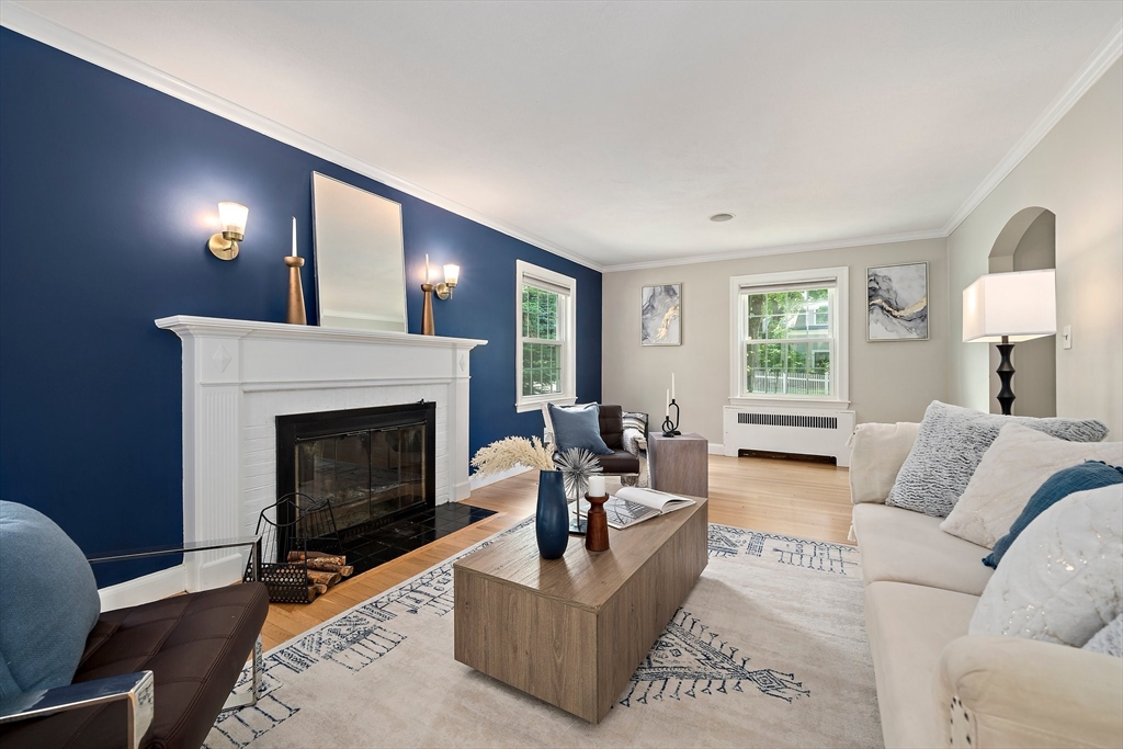 23 Regina Road Newton, MA 02466 - Photo 13 of 42 a living room with furniture and a fireplace