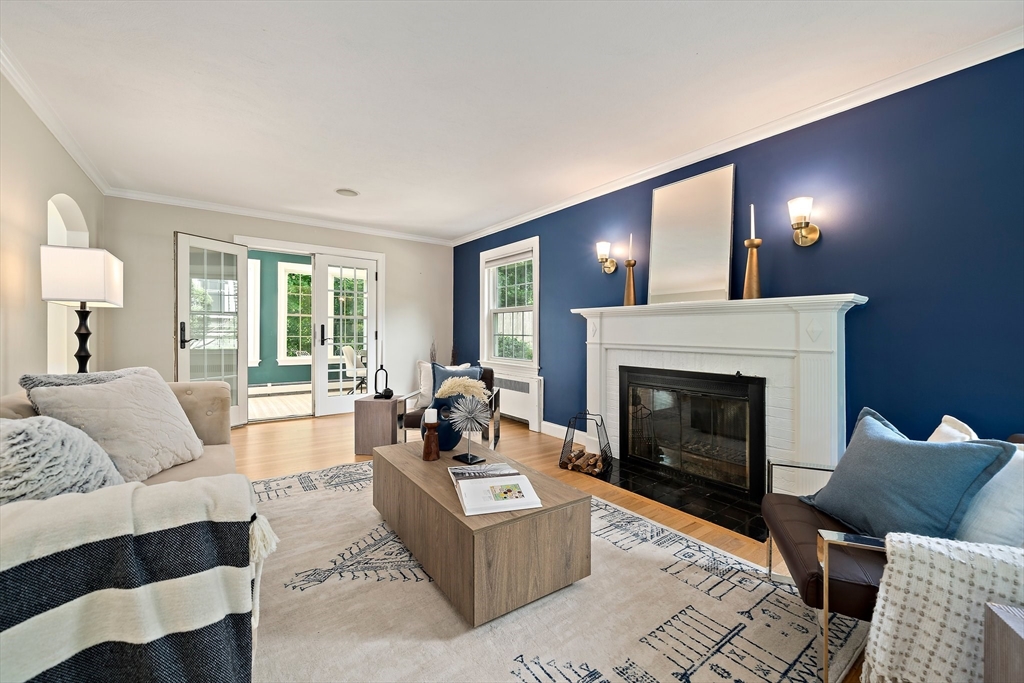 23 Regina Road Newton, MA 02466 - Photo 14 of 42 a living room with furniture and a fireplace