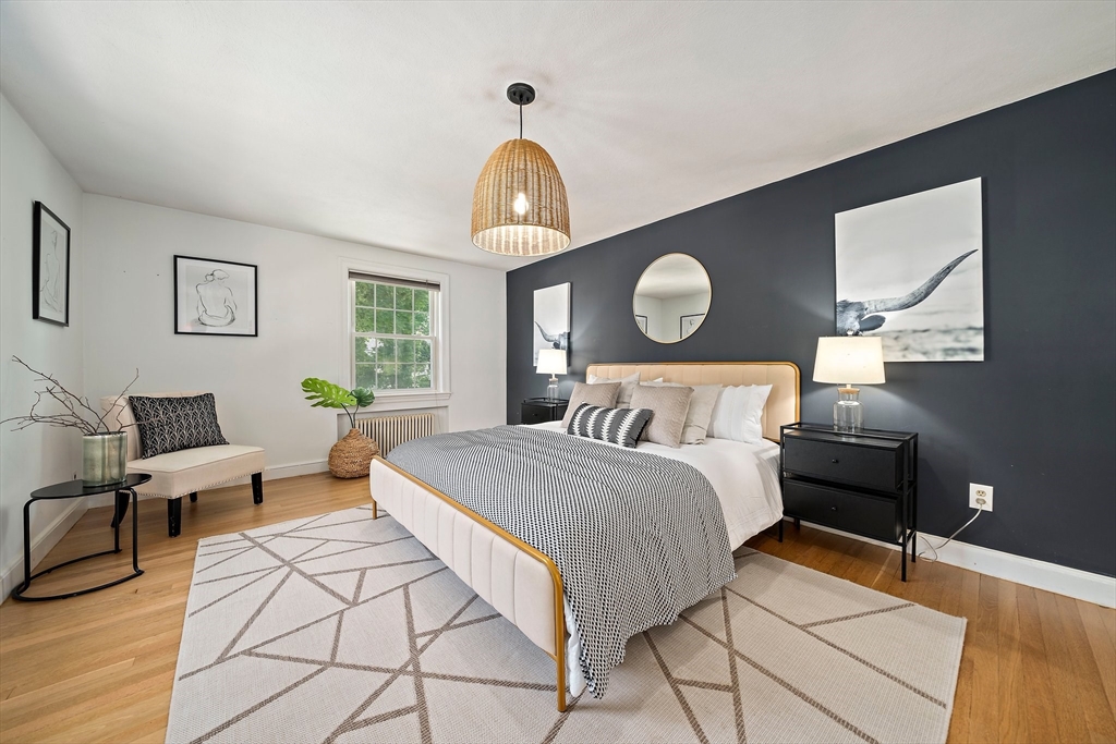 23 Regina Road Newton, MA 02466 - Photo 17 of 42 a bedroom with a bed mirror and a window