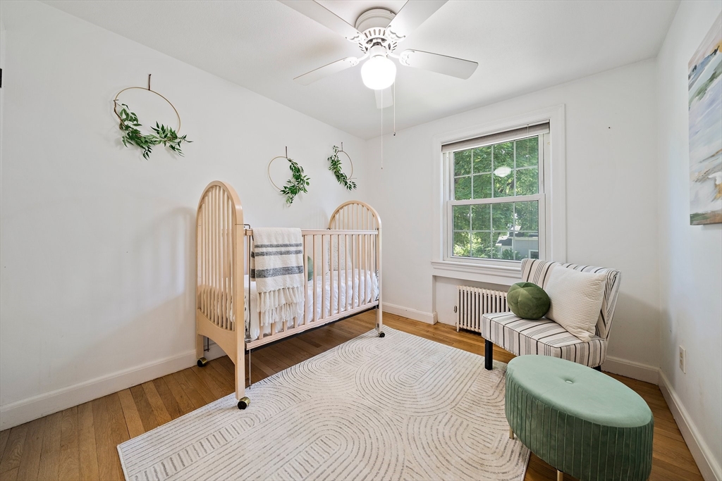 23 Regina Road Newton, MA 02466 - Photo 27 of 42 a bedroom with a bed and a window