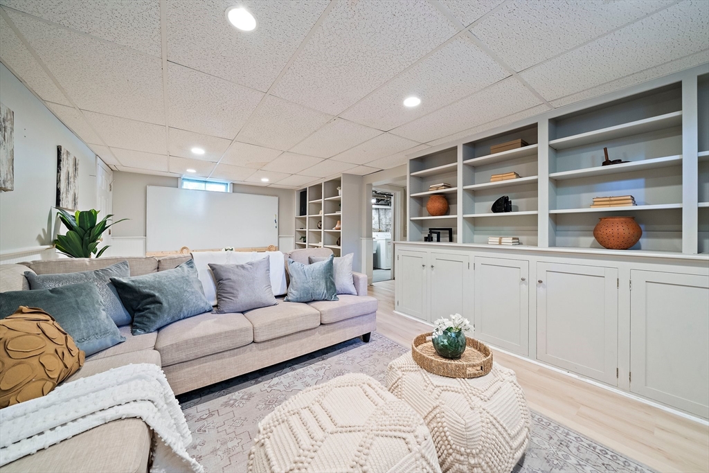 23 Regina Road Newton, MA 02466 - Photo 28 of 42 a living room with furniture cabinets and window