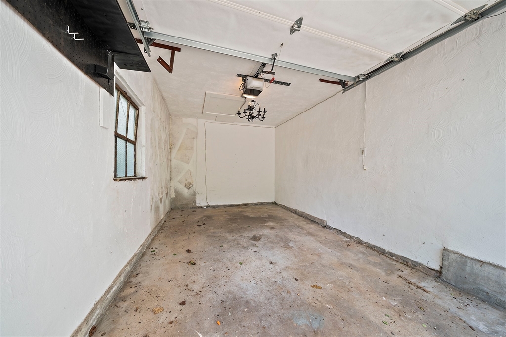 23 Regina Road Newton, MA 02466 - Photo 33 of 42 a view of a hallway with a window