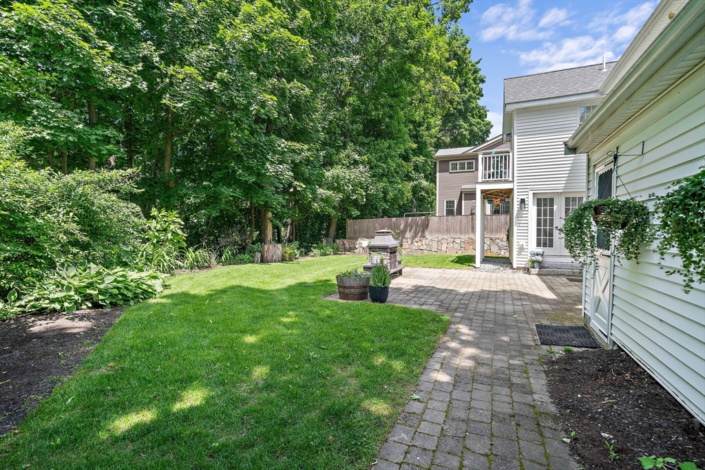 23 Regina Road Newton, MA 02466 - Photo 37 of 42 a view of a house with backyard and sitting area