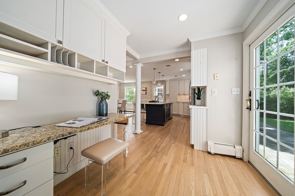 23 Regina Road Newton, MA 02466 - Photo 7 of 42 a kitchen with stainless steel appliances granite countertop a refrigerator and a stove top oven