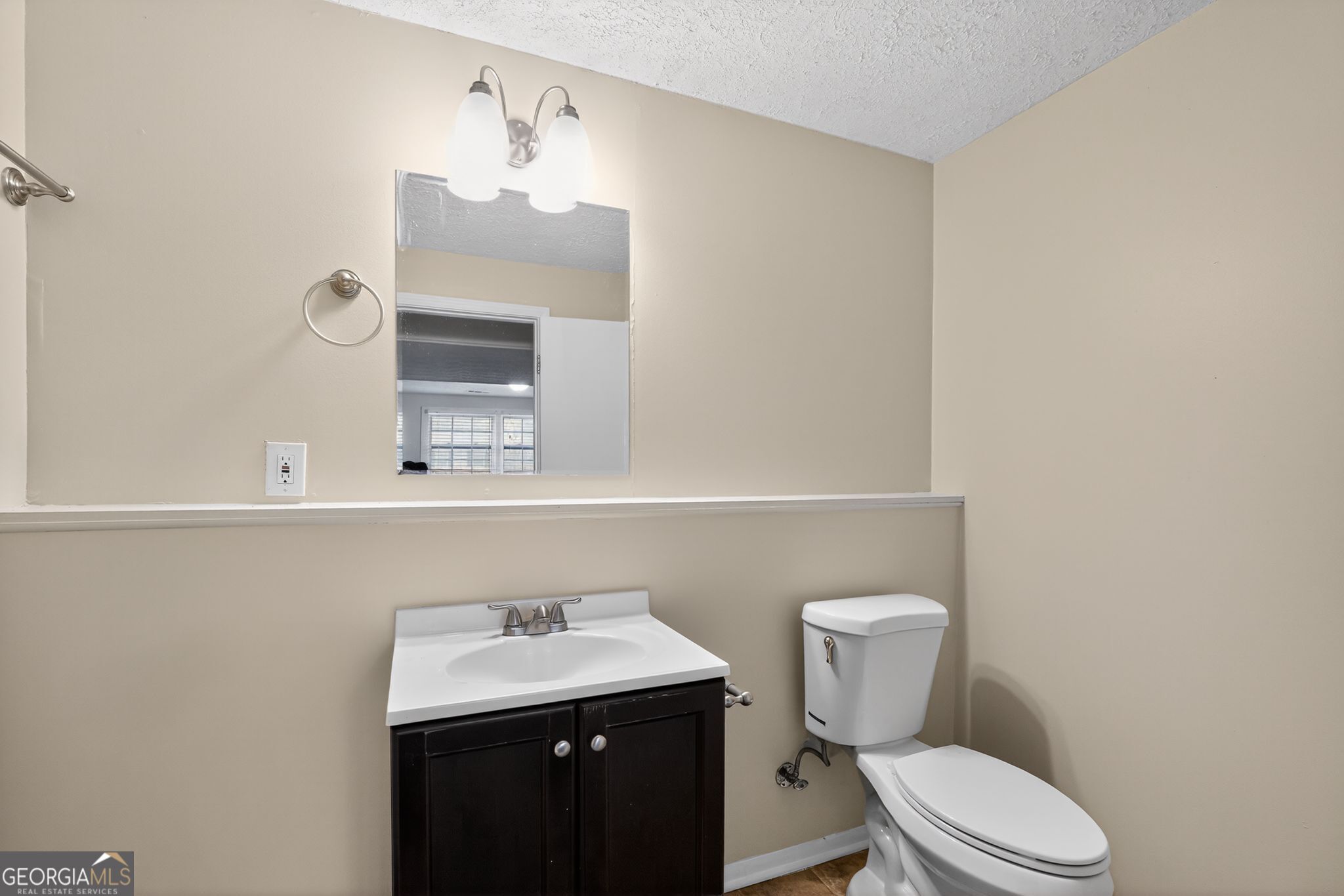 2977 Boring Ridge Drive Decatur, GA 30034 - Photo 22 of 34 a bathroom with a toilet a sink and mirror