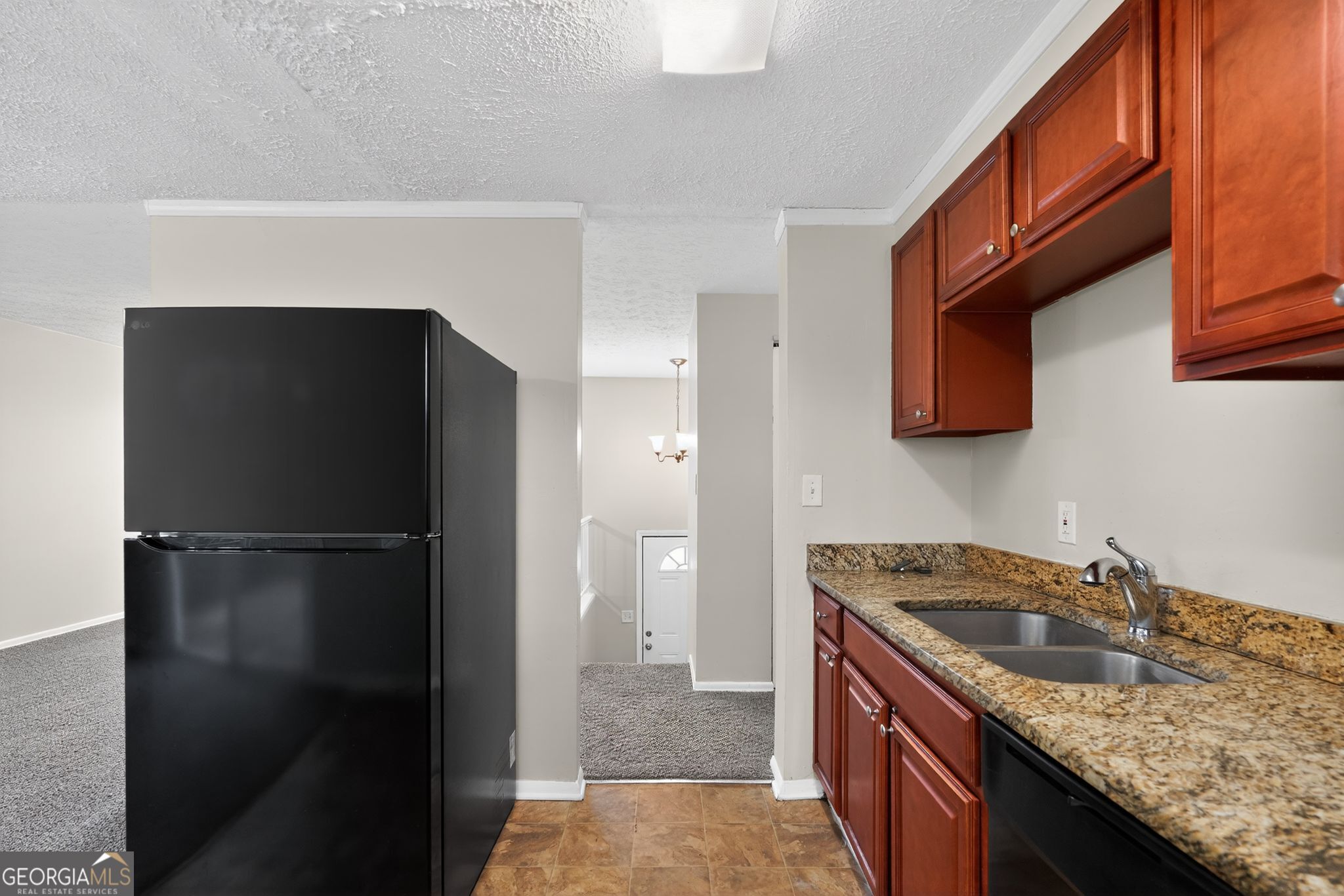 2977 Boring Ridge Drive Decatur, GA 30034 - Photo 8 of 34 a kitchen with a granite countertop kitchen island a refrigerator a sink and dishwasher