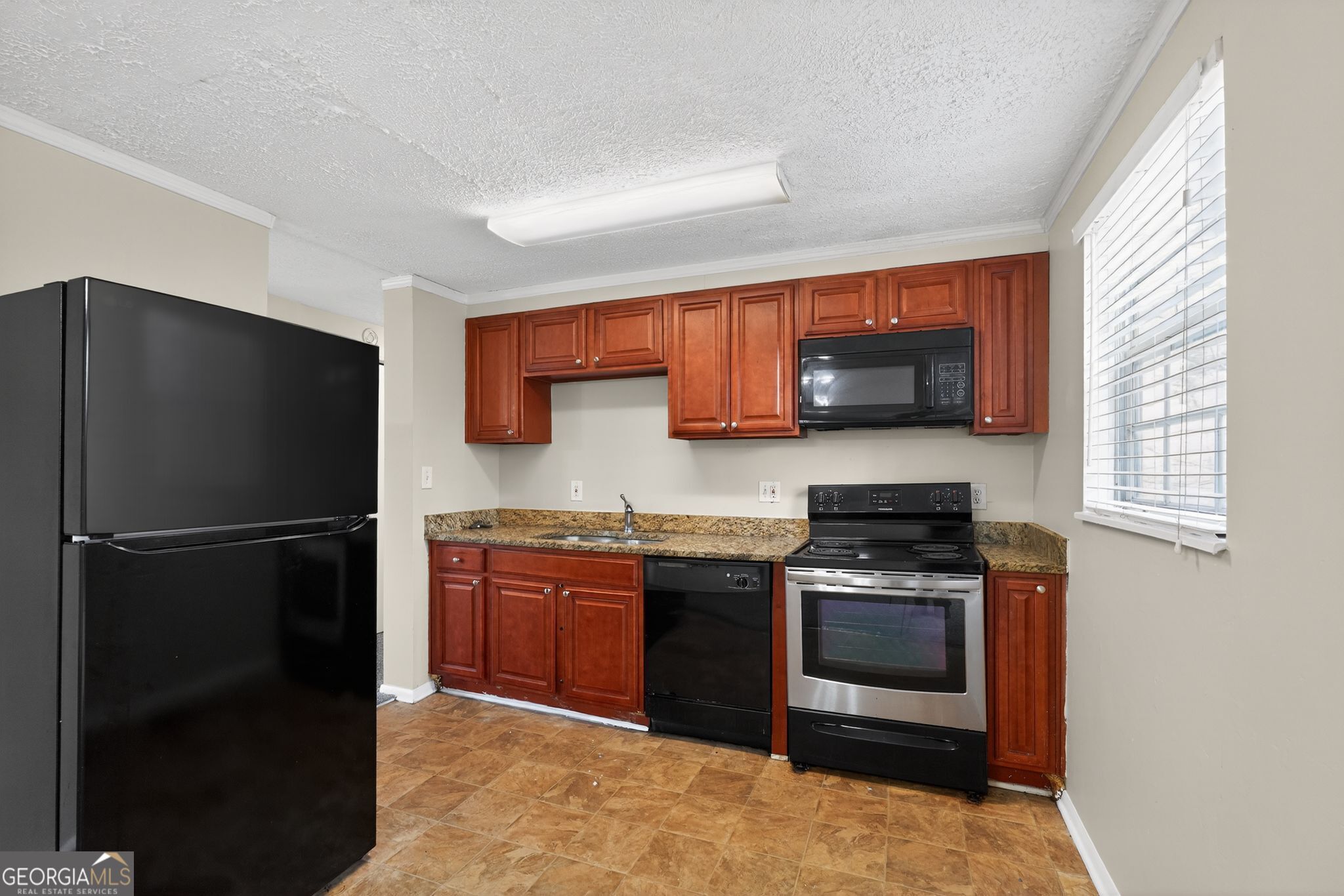 2977 Boring Ridge Drive Decatur, GA 30034 - Photo 10 of 34 a kitchen with stainless steel appliances granite countertop a stove a refrigerator and a sink