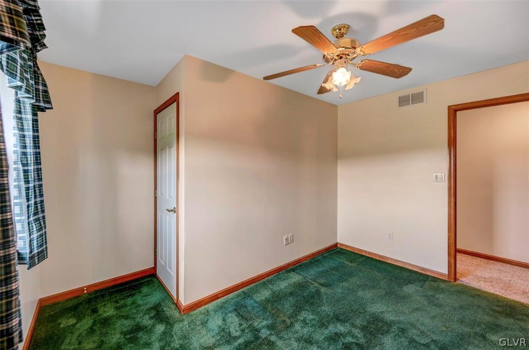 2242 Hill Road Effort, PA 18330 - Photo 32 of 50 an empty room with ceiling fan and wooden floor