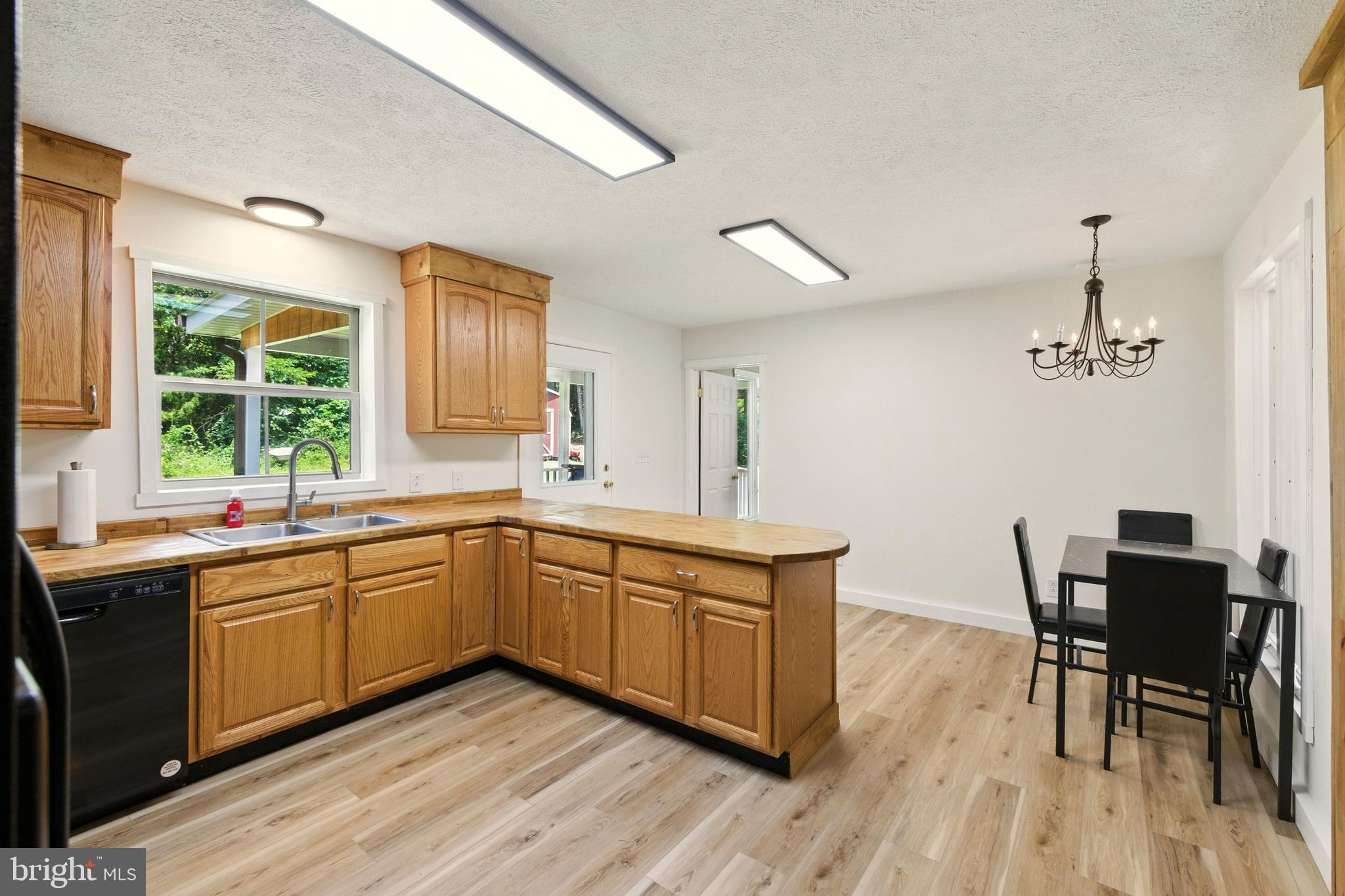 114 Americana Road Luray, VA 22835 - Photo 11 of 67 a kitchen with a sink cabinets and wooden floor