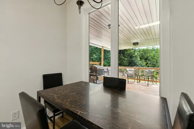 a kitchen with stainless steel appliances granite countertop a stove a refrigerator and a microwave