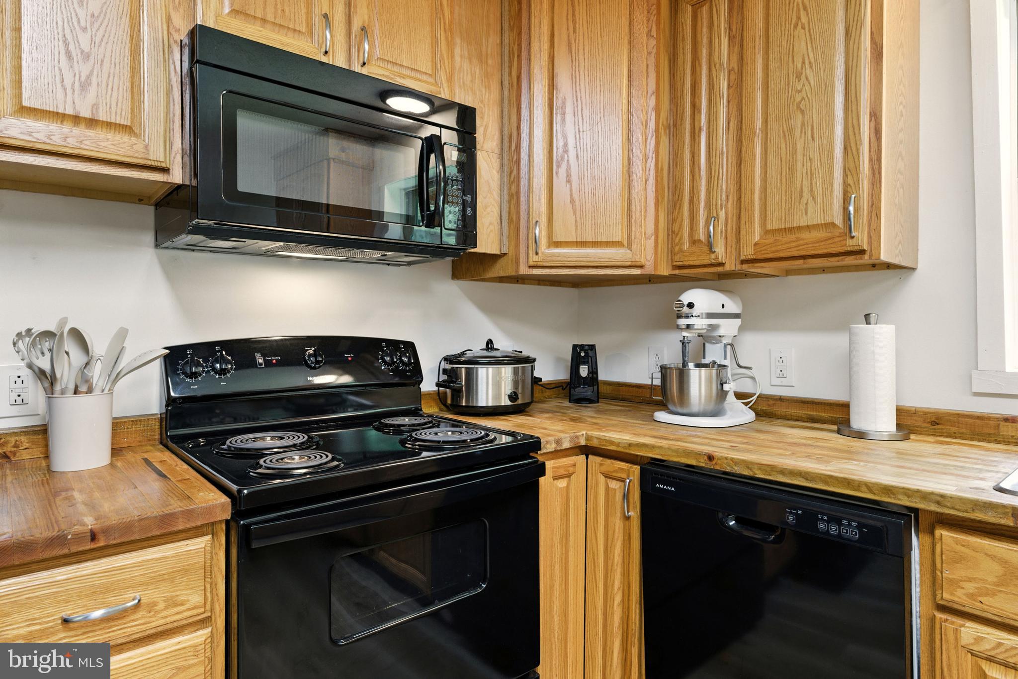 114 Americana Road Luray, VA 22835 - Photo 15 of 67 a kitchen with stainless steel appliances granite countertop a stove and a microwave