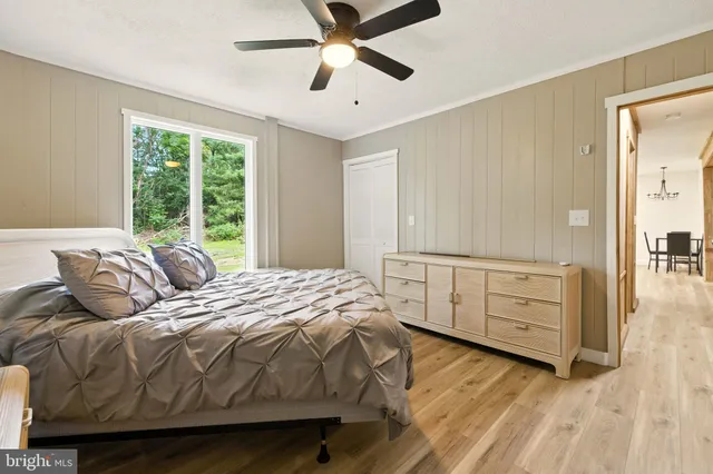 a bathroom with a sink a toilet and shower curtain