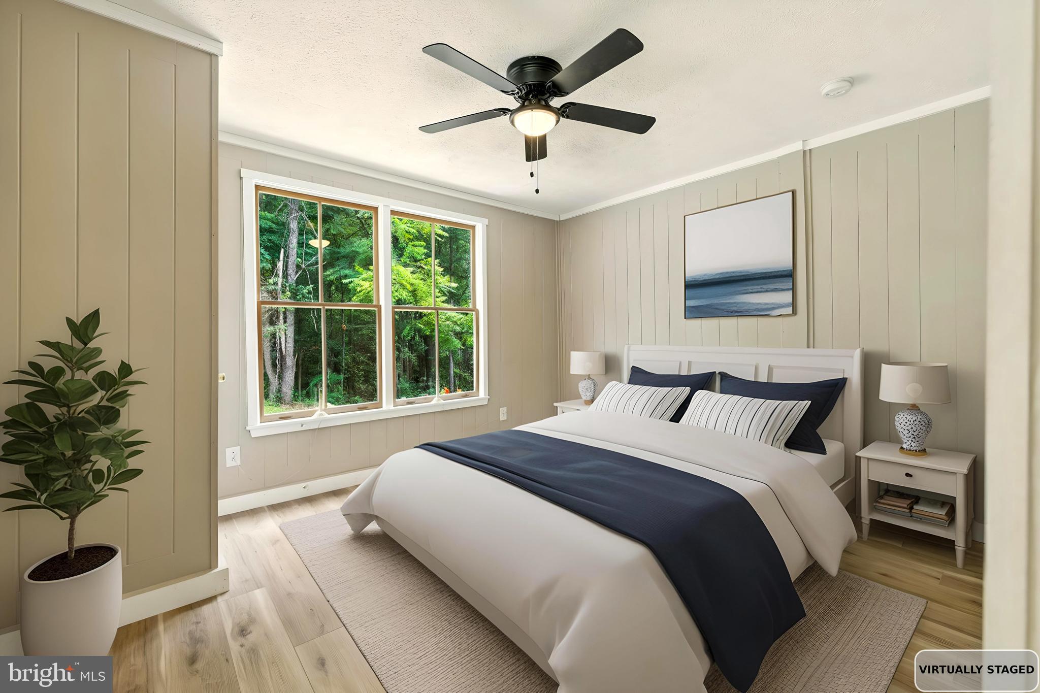 114 Americana Road Luray, VA 22835 - Photo 28 of 67 a bedroom with a large bed and a large window