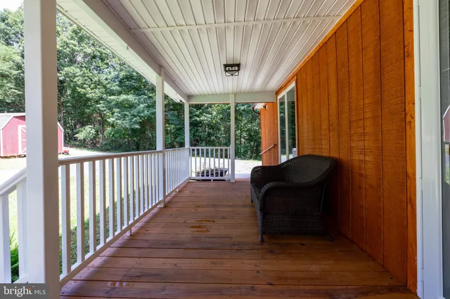 a view of a patio with a table chairs and a patio