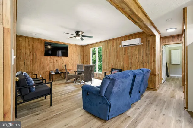 a living room with furniture and a window
