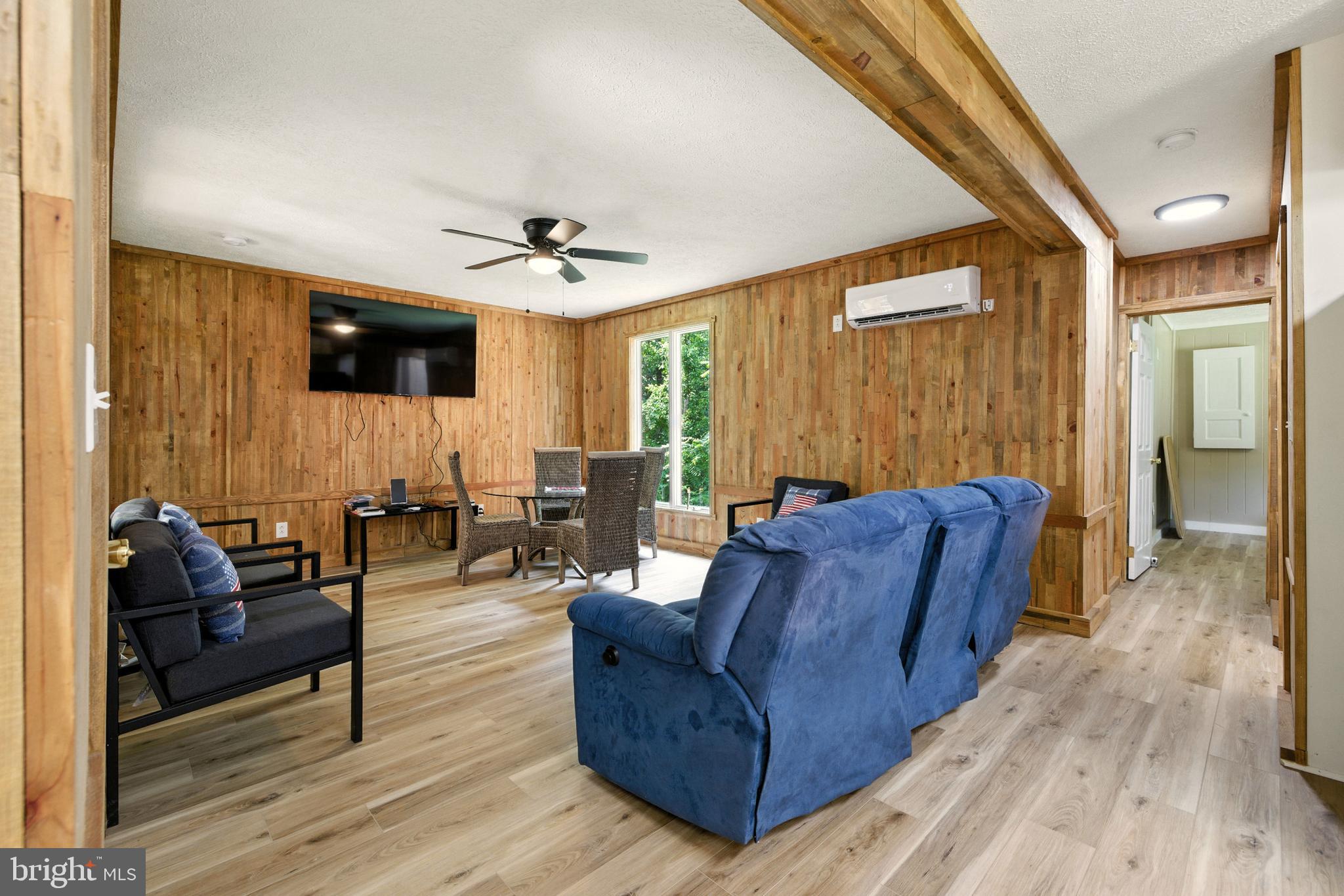 114 Americana Road Luray, VA 22835 - Photo 4 of 67 a living room with furniture and a flat screen tv