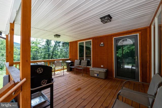 an aerial view of residential house with yard and outdoor space