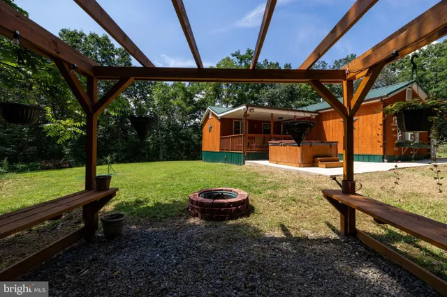 an aerial view of a city with lots of residential buildings and mountain view in back
