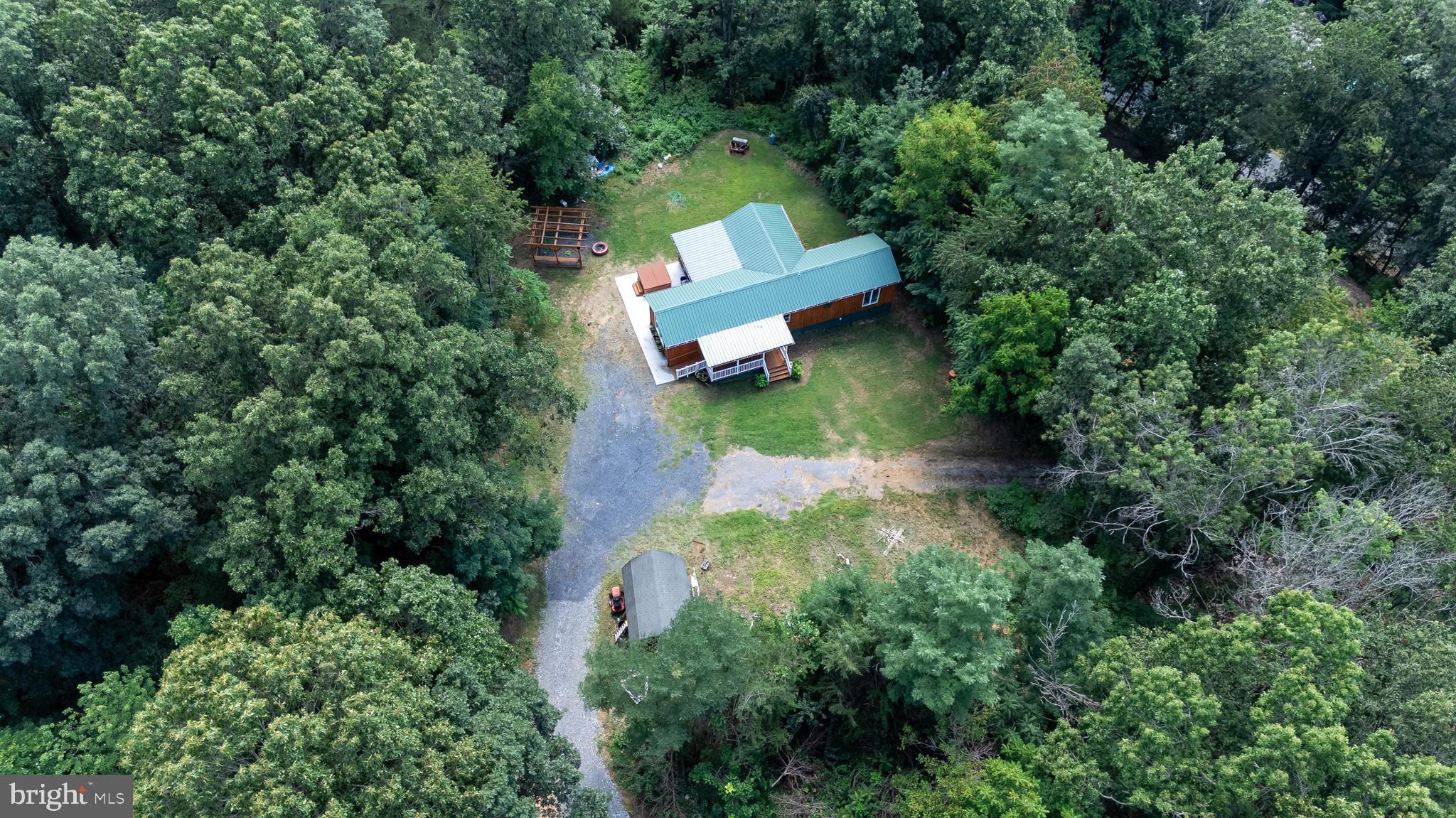 114 Americana Road Luray, VA 22835 - Photo 57 of 67 an aerial view of a house with a yard and lake view