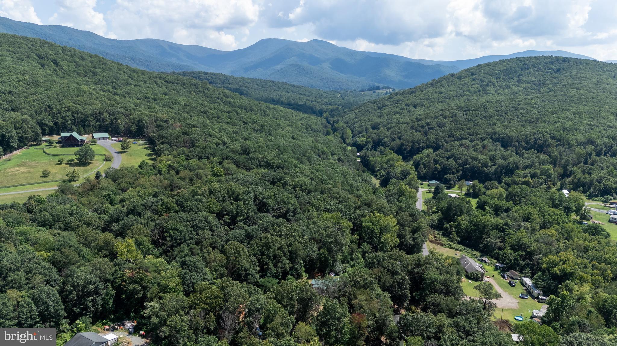 114 Americana Road Luray, VA 22835 - Photo 62 of 67 an aerial view of a house with mountain view