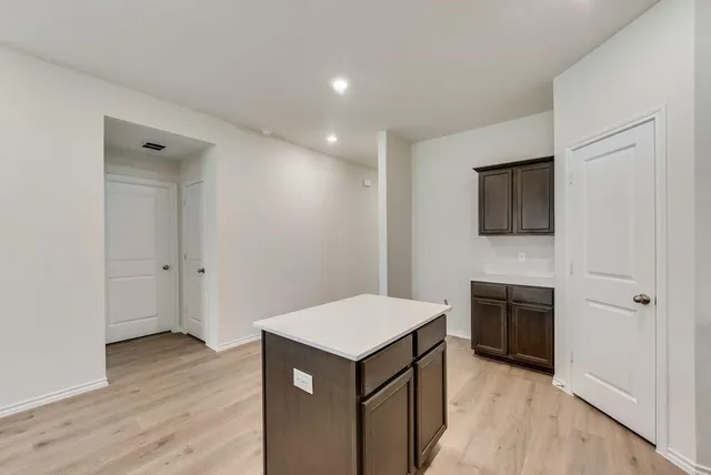 a kitchen with a stove and a microwave