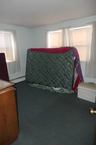 a room with a closet and wooden floor