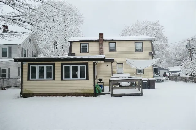 a view of a car park in front of house