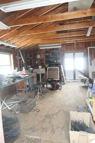 a view of a studio with wooden floor