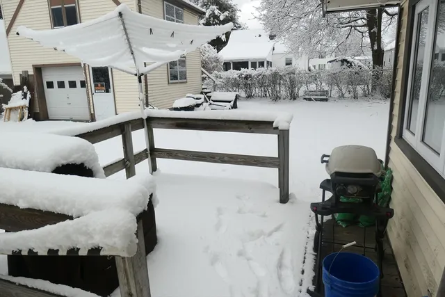 a room with a window and a dresser