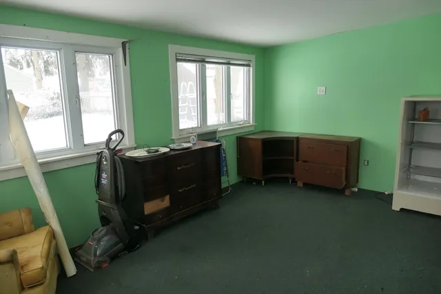 a room with furniture and a window