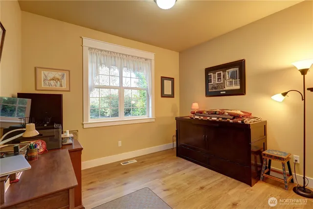 a view of workspace with furniture and window