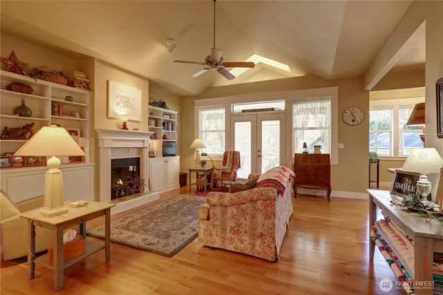 a living room with furniture fireplace and flat screen tv