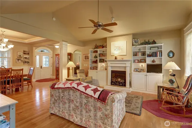 a living room with fireplace furniture and a fireplace
