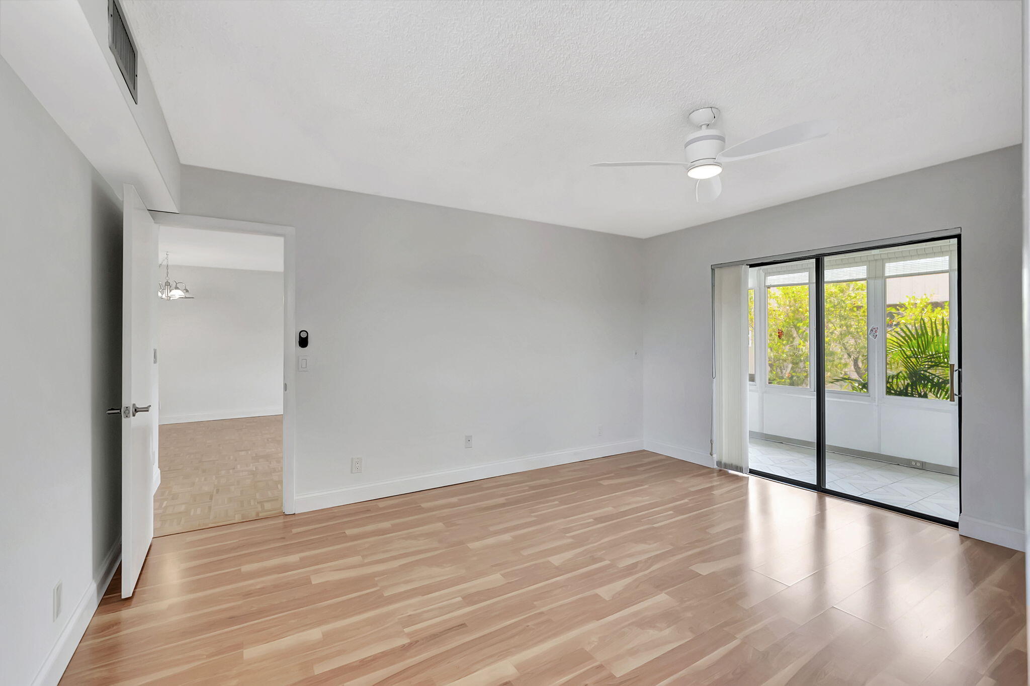 124 Capri B Delray Beach, FL 33484 - Photo 20 of 69 wooden floor in an empty room with a window