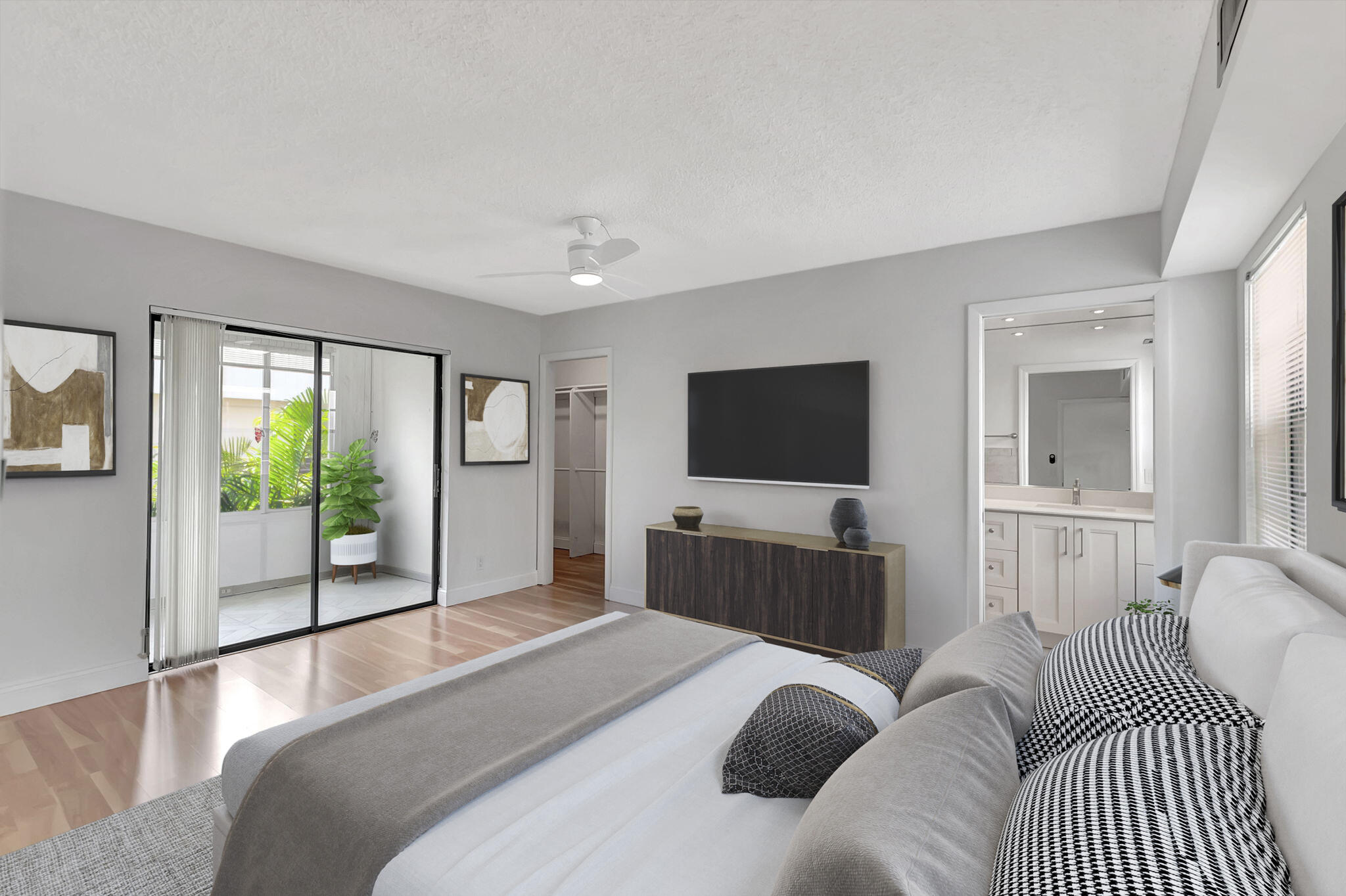 124 Capri B Delray Beach, FL 33484 - Photo 2 of 69 a bedroom with a bed and a flat screen tv