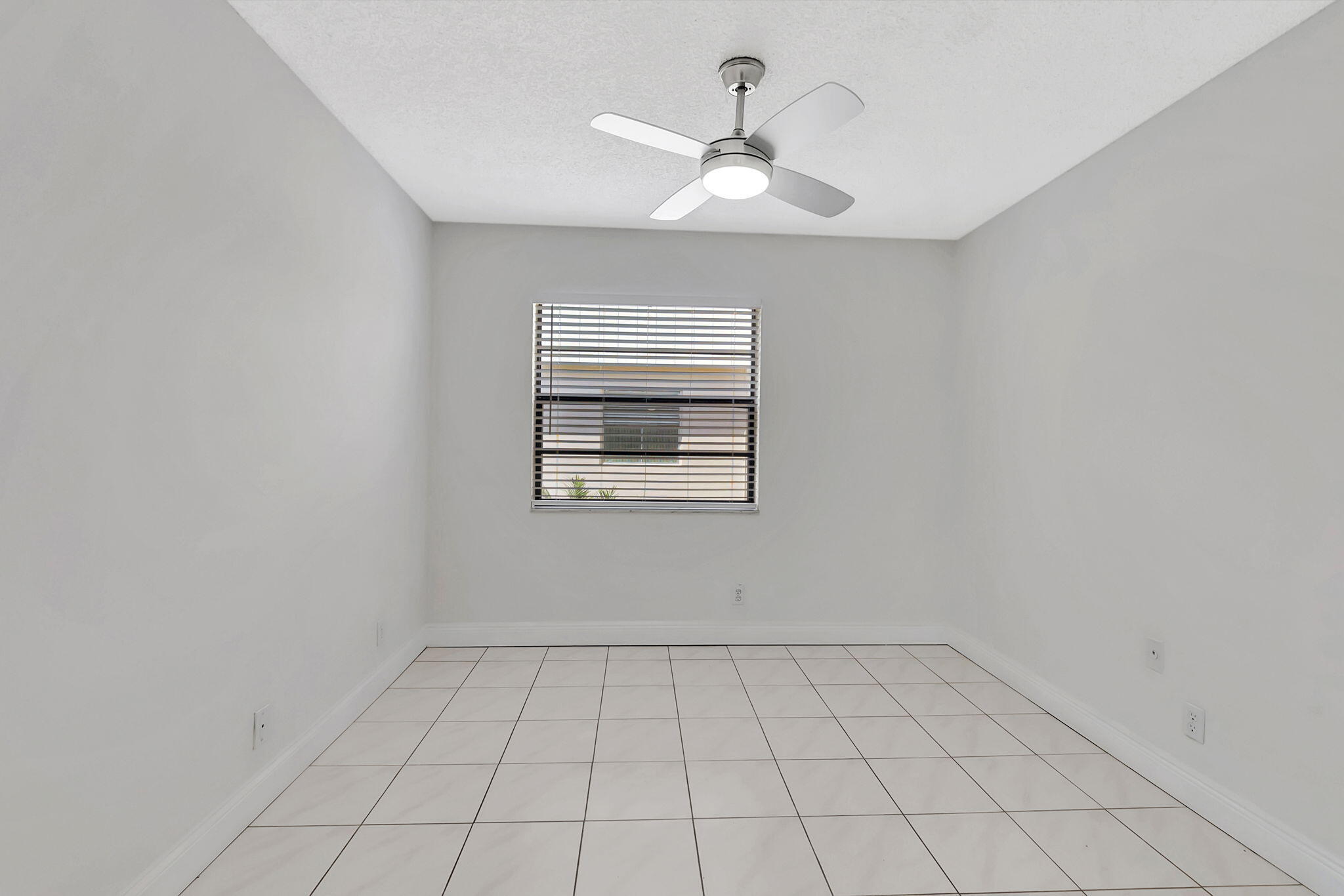 124 Capri B Delray Beach, FL 33484 - Photo 23 of 69 a view of an empty room with a window
