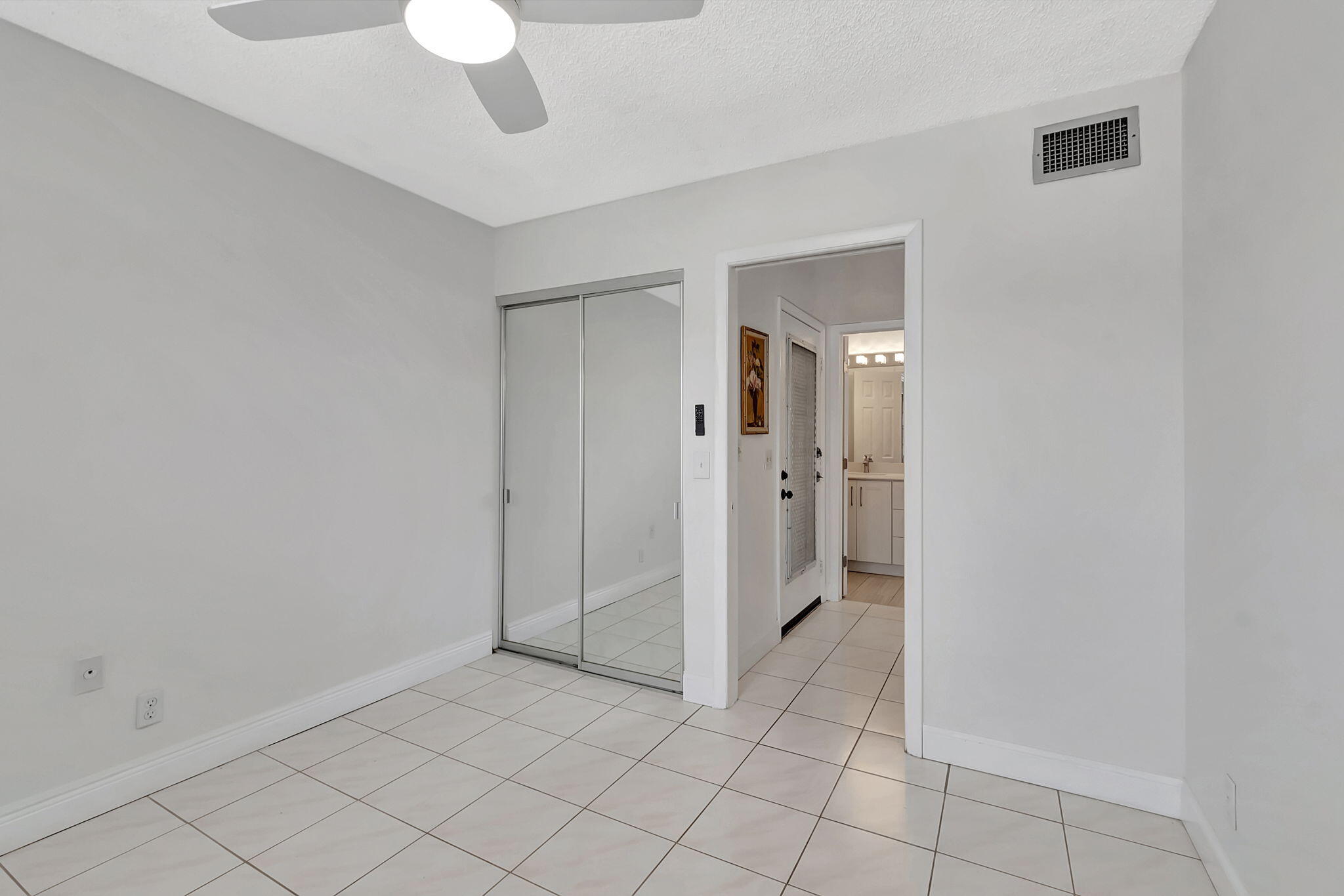 124 Capri B Delray Beach, FL 33484 - Photo 24 of 69 a view of an empty room and closet in a room