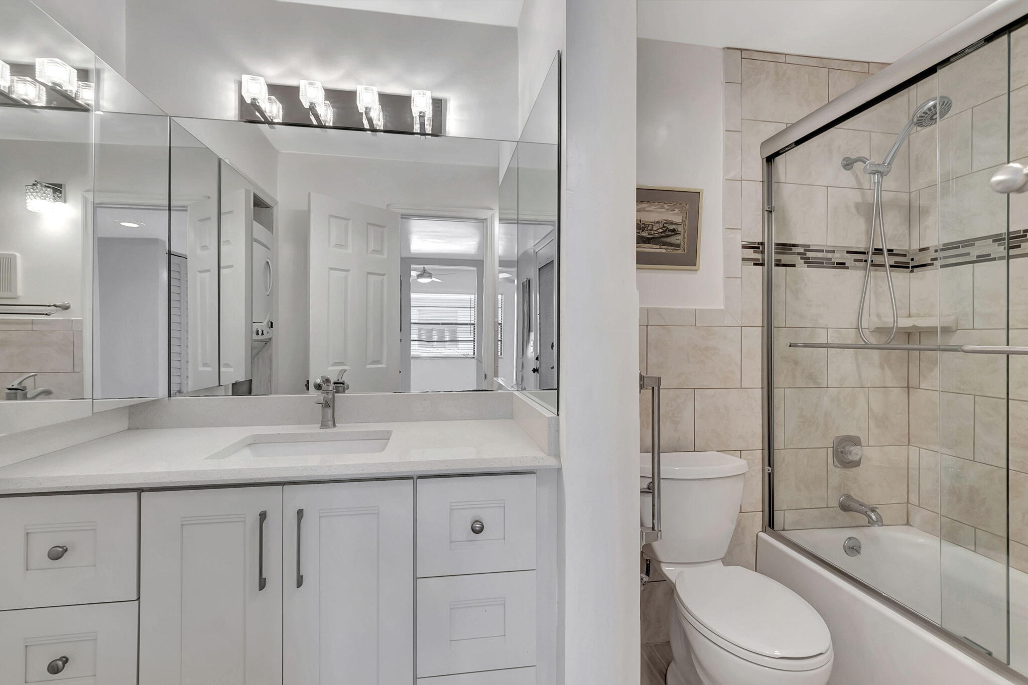 124 Capri B Delray Beach, FL 33484 - Photo 25 of 69 a bathroom with a granite countertop sink toilet and shower