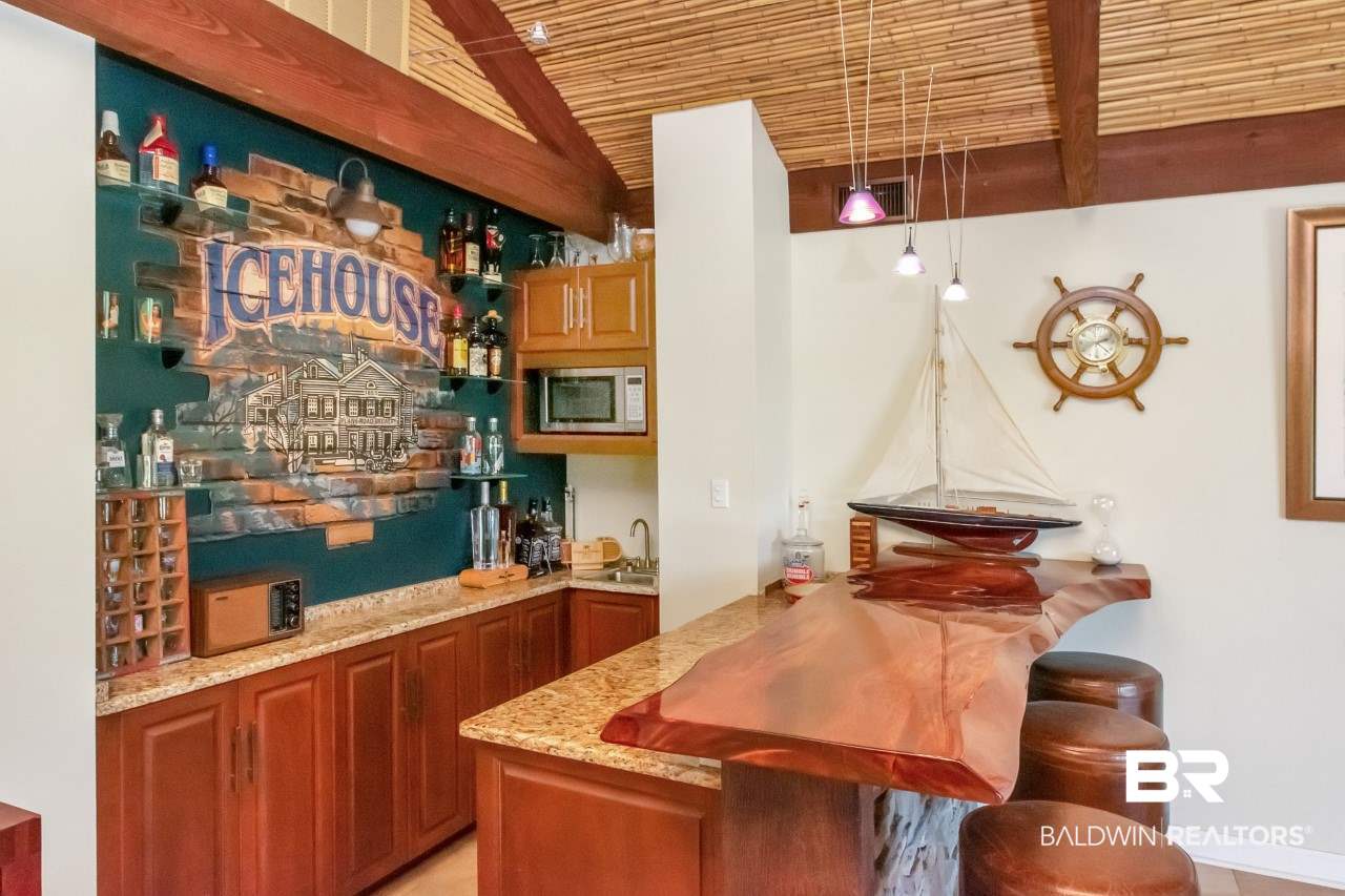 11000 Kelly Road Mobile, AL 36608 - Photo 21 of 48 Bar in garage living area features custom bar top.