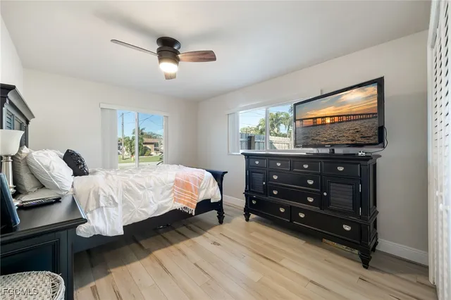 a bed room with a bed and a television